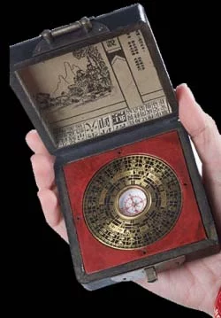 luo pan (Feng SHui) compass in hand